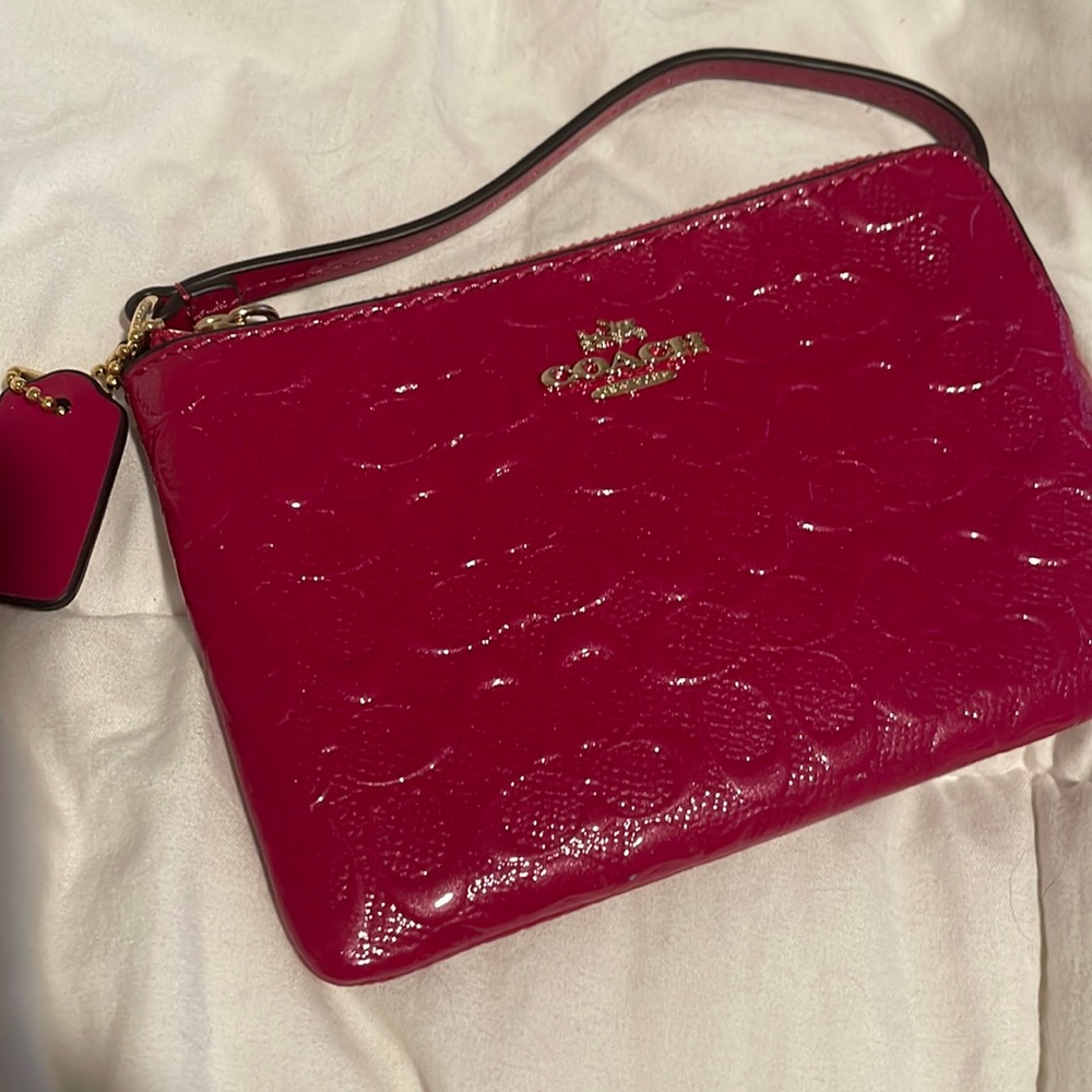 Pink coach wristlet